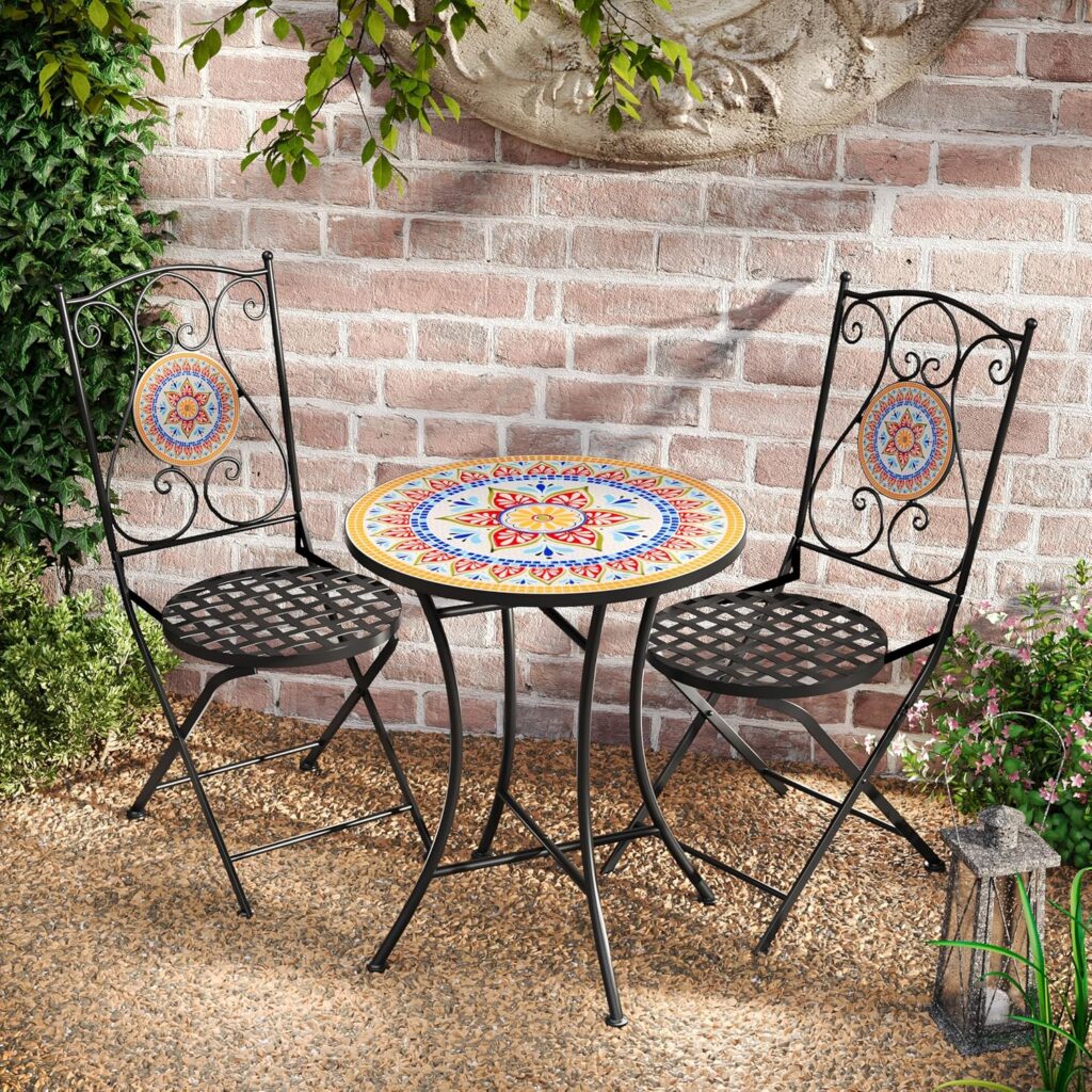 Outdoor mosaic bistro table set with two matching chairs on a small patio or balcony