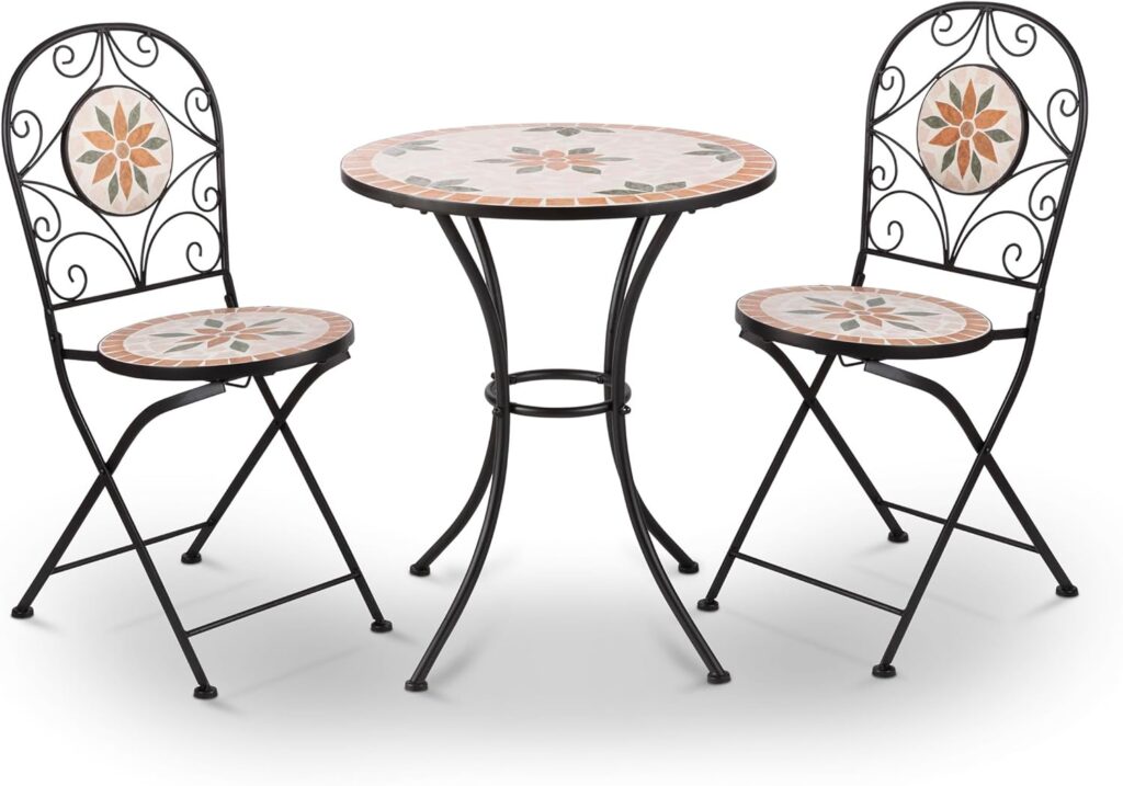 Tan floral mosaic bistro table with two folding chairs on a small patio or balcony